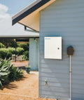 Built Like A Tank Waterproof Electrical Junction Box With Lockable Cover And Ip66 Seal Designed To Handle Outdoor Circuit Runs And Seasonal Lighting In 24 X 16 X 10 Inch Heavy Duty Steel Cabinet mounted on a house wall.