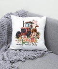 Farm Animal Iron On Transfers Set For T Shirts And Hoodies Cows Pigs Chickens With Barnyard Motifs Like Tractor And Windmill Washable DTF Decals Ready To Press For Clothing DIY Gifts pillow with cow and tractor design on a gray sofa.