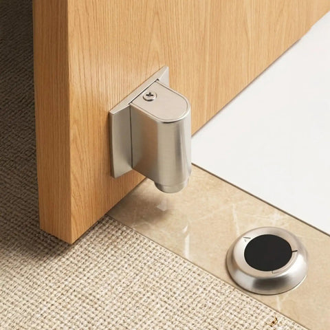 Super Heavy Duty Invisible Door Stopper With Strong Adhesive Or Screws For Solid Steel Zinc Alloy Hold Keeps Bedroom Doors Locked In Place Without Drilling Holes And Looks Sleek With Brushed Nickel Finish mounted on wooden door.