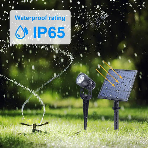 Built Tough Metal Solar Spot Lights Outdoor With 9.8 Foot Cable Low Voltage IP65 Waterproof Landscape Lighting For Garden Yard Pathway Garage Warm White 2 In 1 Auto On Off, shown with IP65 waterproof rating in garden setting