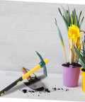 Yellow Plastic-Clad Pickaxe With Lightweight Fiberglass Handle For Gardening, Yard Work, And Planting next to flower pots