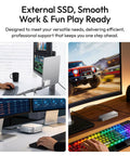 Heavy Hitting M2 Nvme Enclosure Delivering Legit 80Gbps Usb4 Speeds For Quick File Swaps, shown in workspace with monitors and hands typing.
