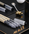 Close-up of 12 Pack 0.35mm Black Gel Ink Pens Extra Fine Point for Office and School Use on black tray