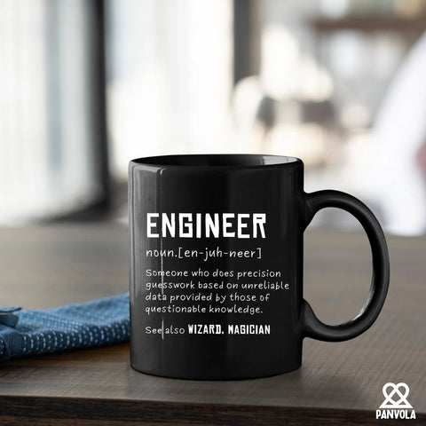 Engineer Definition Ceramic Mug 11 Oz Black Funny Gift For Engineering Students And Pros on wooden desk