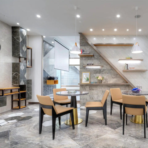 Modern interior with marble flooring, dining table, and chairs under ambient lighting.