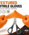 Rock Solid 8 Mil Orange Nitrile Work Gloves 100 Pack Medium Chemical Resistant Disposables showing stretch and grip with scissors.