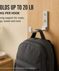 Legit Heavy Duty Folding Wall Hooks 4 Pack Silver Aluminum Alloy Flip Down Coat Rack holding a backpack on wood door.