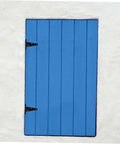 Front view of blue wooden shed door with black heavy-duty slotted hinges on the left edge.