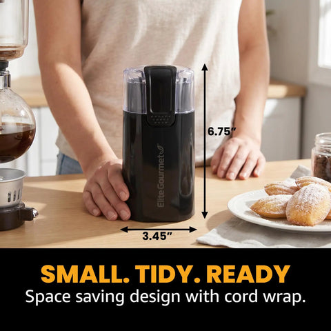 Elite Gourmet ECG914 Electric Coffee And Spice Grinder Heavy Duty Stainless Steel Blade One Touch Operation Black compact design in kitchen.