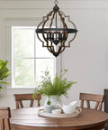 Dining room with Six Light Rustic Farmhouse Chandelier With Walnut Wood Grain Metal Finish And Textured Black Accents hanging above table.