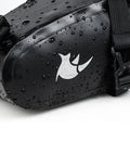 Close-up of waterproof under seat saddle bag for bike with 1.5L capacity, rainproof MTB and road bike seat bag, wet with water droplets.