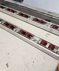 Close-up view of 2 Sets Dual Nylon Wheels Sliding Door Rollers with 8 Screws for PVC Track Window Slider Replacement.
