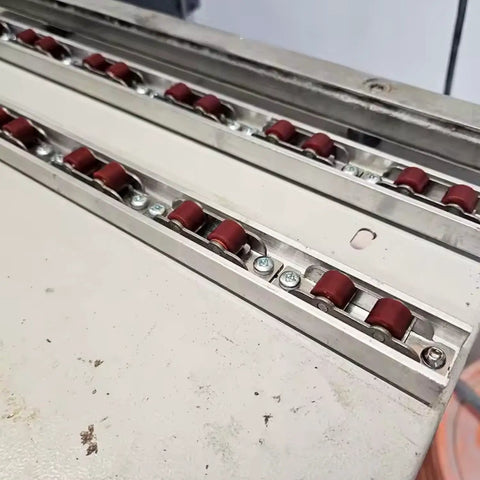 Close-up view of 2 Sets Dual Nylon Wheels Sliding Door Rollers with 8 Screws for PVC Track Window Slider Replacement.