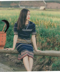 Manganese Steel Long Handle Scythe For Weeding And Lawn Care with basket in rural setting, landscape background