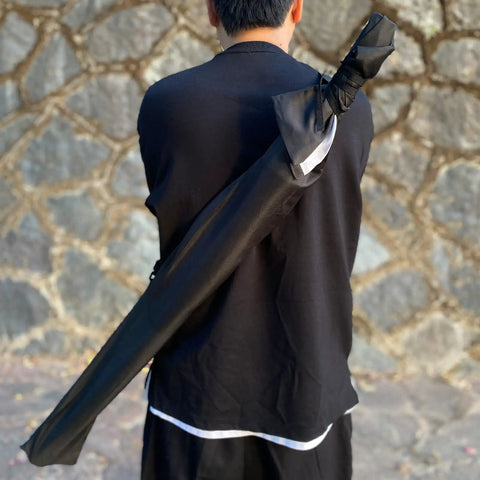 Person holding 41 Inch Polypropylene Katana Sword For Training With Black Scabbard High Toughness Practice Blade