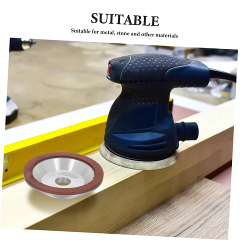 Image of Heavy Duty Diamond Cup Grinding Wheel 100mm Silver Concave Abrasive Disc next to an electric tool on wood surface.