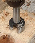 8 Piece Forstner Bit Set Kickass Heat Treated Carbon Steel Drill Bits For Wood 1/4 To 1 3/8 Inch drilling into wood surface