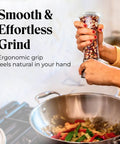 Hands using Must-Have Salt and Pepper Grinder Set With Stand, Glass Body Grinders With Stainless Steel Caps, cooking over a stove.