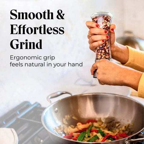 Hands using Must-Have Salt and Pepper Grinder Set With Stand, Glass Body Grinders With Stainless Steel Caps, cooking over a stove.