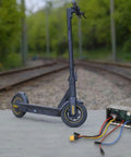 Replacement Main Controller Board for Ninebot Max Electric Scooter displayed with scooter near railway