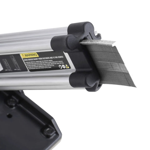 Close-up of Built Tough Air Powered 18 Gauge L Cleat Flooring Nailer showing cleats feeding mechanism and safety warning.