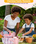 Mother and child gardening with Eight Piece Kids Gardening Tool Set With Shovel Rake Watering Can Hat Apron Gloves And Storage Bag Pink Flower Theme Real Tools For Toddlers And Kids In A Fun Handcrafted Style.