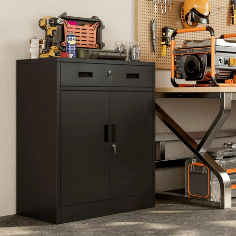 Beefy Heavy Duty Metal Storage Cabinet With One Drawer And Adjustable Shelf For Garage Office Or Home Locking Short Cabinet In Black Built To Last For Tools And Gear 36 Inch H By 27.5 Inch W By 16 Inch D in garage setting.
