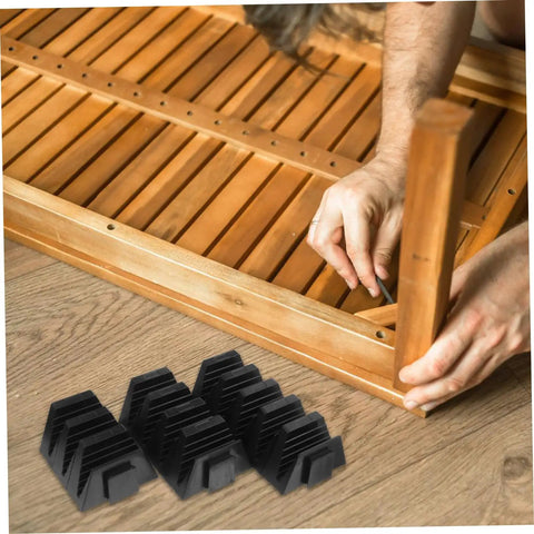 Person assembling wooden furniture with Modular Wrench Organizer Rack 12-Piece Plastic Tool Storage Tray nearby on floor