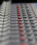 Close-up of 12 Channel Mixer With USB And SPX Digital Effects, Studio Grade D Pre Preamps Deliver Fat Bass, buttons and sliders view
