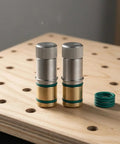 Self-Locking Table Stop Set For Workbench Holes on wooden surface, showcasing cylindrical design with knurled top and green rings