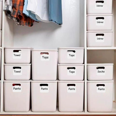 Erasable Label Holders Kit With 20 White PVC Bin Clips And 2 Chalk Markers used on storage bins labeled Towel, Tops, Pants