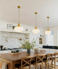 Vintage Brass Pendant Lamp With White Pleated Milk Glass Ceiling Fixture For Kitchen Island Hallway Bedroom Decor Antique Drum Chandelier, hanging above wooden kitchen island with floral arrangement.