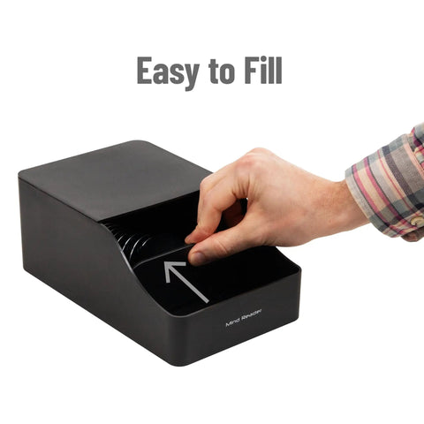 Hand reaching into black Hot Cup Sleeve Dispenser For Coffee Bar And Kitchen Organization, Grab And Go Space Saving Coffee Station Accessory.