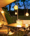 2 Pack Solar Lanterns With 30 LED Waterproof Garden Lights illuminating a camping scene with a warm white glow, hanging by a tent.