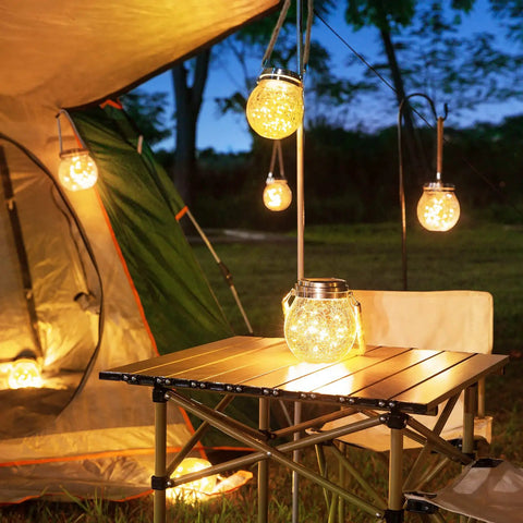 2 Pack Solar Lanterns With 30 LED Waterproof Garden Lights illuminating a camping scene with a warm white glow, hanging by a tent.