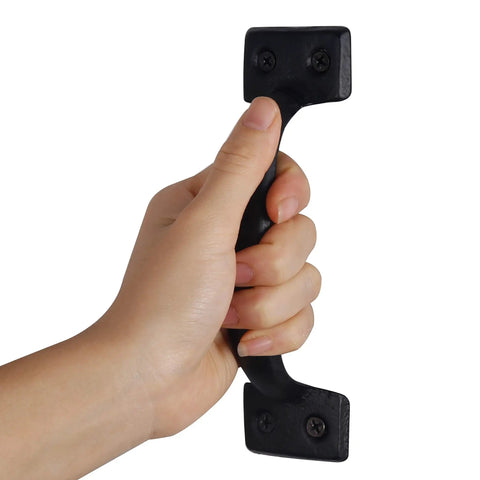 Hand holding Heavy Duty Cast Iron Sliding Barn Door Handle Vintage Gate Pull For Fence Cabinet Outdoor Garage And Interior Black Finish Six
