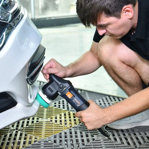 Person using 3 Inch Dual Action Car Buffer Polisher with 9mm Orbit on white car bumper for detailing