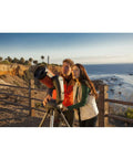Couple using NexStar 6SE Computerized Telescope Bundle With Eyepiece And Filter Accessory Kit For 1.25 Inch Optics at seaside.