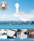 USB Powered Mini Ceiling Fan With Six Blades Quiet DC 5V USB Hanging Fans For Indoor Outdoor Use shown above a cityscape