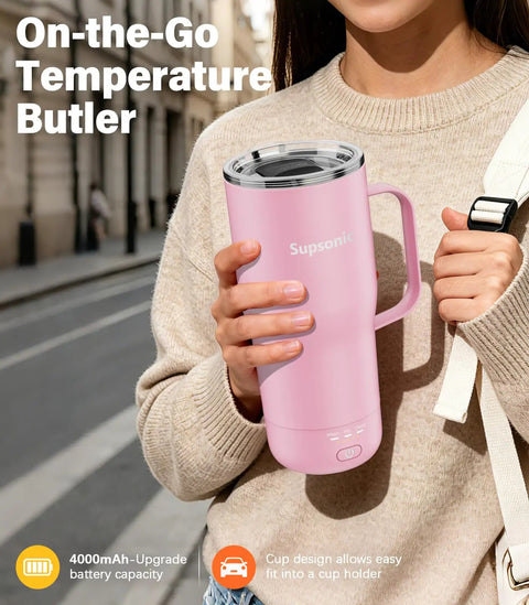 Self Heating Coffee Mug 20oz Electric Temp Control Warmer Keeps Your Brew Piping Hot With Three Rad Heat Settings Zero Room For Cold Swigs Perfect For Office Grind Or Backroad Adventures Rechargeable Design held by woman in pink, outdoors, with cup holder design.
