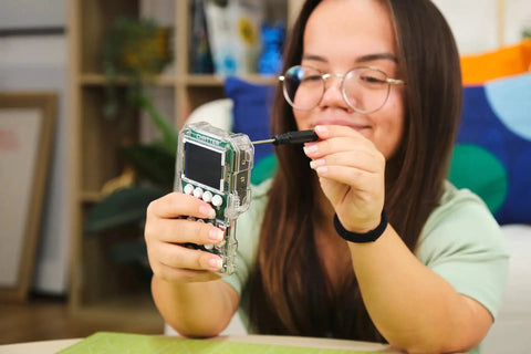 DIY Wireless Encrypted Two Way Communication Kit For Kids And Teens Learn Electronics Coding And Encryption With A Fun STEM Radio Project For Ages Eleven And Up girl assembling handheld radio device