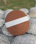 Pro Grade Synthetic Silk Tsuka Ito Wrapping Cord 22.9ft roll for katana on stone surface