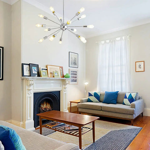 Mid Century Modern Pendant Light 6 Light Sputnik Chandelier In Black And Gold With Adjustable Arms in a stylish living room setting