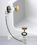 Rock Solid 1 1/2 Inch Schedule 40 Pvc Cable Driven Bath Waste Kit showing brass hardware and PVC fittings in a bathtub.