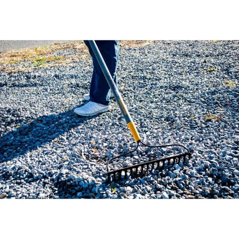 Person using Steel 16 Tine Bow Rake With 57 Inch Hardwood Handle And Cushy Grip For Small Yard Work And Landscaping Projects