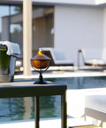 4 In 1 Outdoor Mosquito Torch Set With Tabletop Stands Deck Mounts And Ground Stakes In Copper by a pool