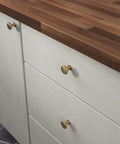 Champagne Bronze Cabinet Knobs Set Ten Pack One And A Quarter Inch Round Mushroom Pulls For Cabinets Drawers Kitchen Doors Vanities And Furniture Upgrade Your Home With Dope Hardware on white cabinets