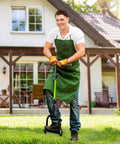 Person using 4 In 1 Lawn Aerator Tool With Detachable Heads And Wide Foot Plate, Manual Spike Aeration on a lawn in front of house.