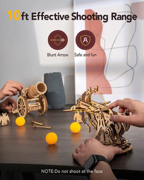 DIY Wooden Catapult Kit 3D Puzzle for Adults and Kids With Wheels and Gears Ballista Model Building Kit 142 Parts With Step by Step How To Guide, wooden ballista on table