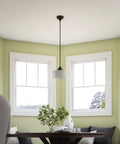 Cambridge 1 Light Pendant in Blackened Oil Rubbed Bronze With White Glass Shade in dining room with bay window.